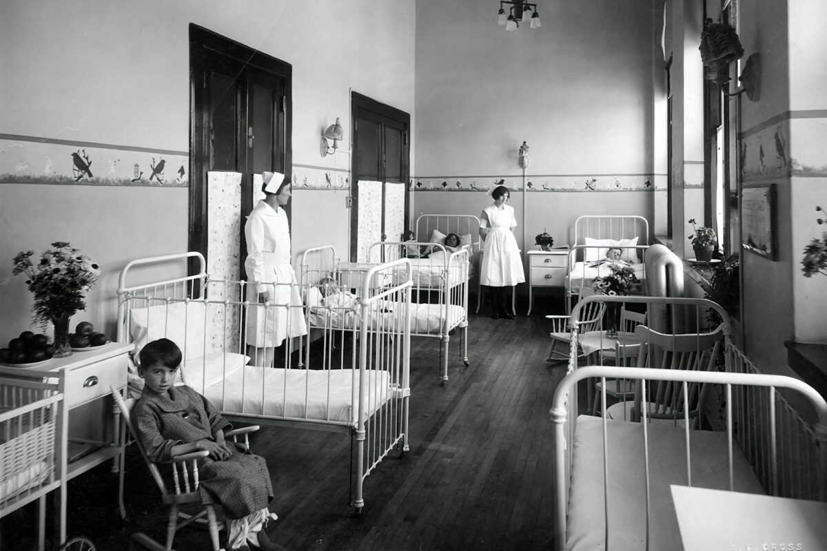 Nurse in UK hospital corridor representing UK Health and Care Worker visa 2026