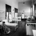 Nurse in UK hospital corridor representing UK Health and Care Worker visa 2026