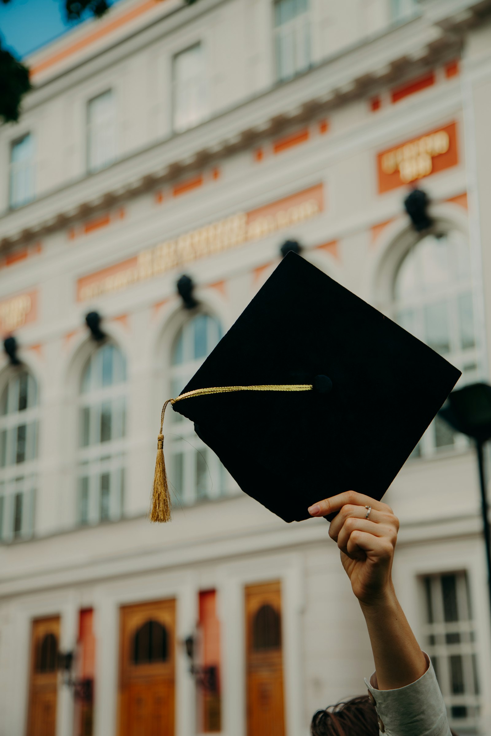 Canada Study Permit Refusal student in cap reading rejection letter