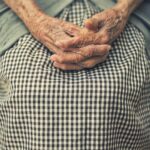 Caregiver Visa Routes 2026 African care worker assisting elderly client