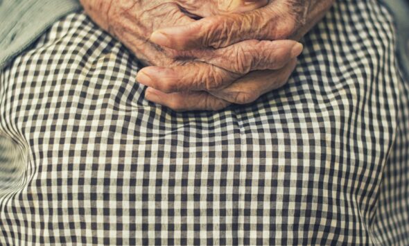 Caregiver Visa Routes 2026 African care worker assisting elderly client