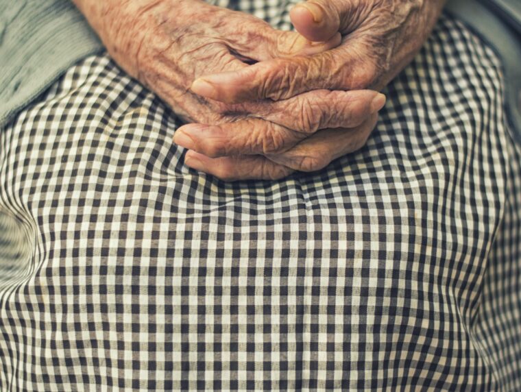 Caregiver Visa Routes 2026 African care worker assisting elderly client