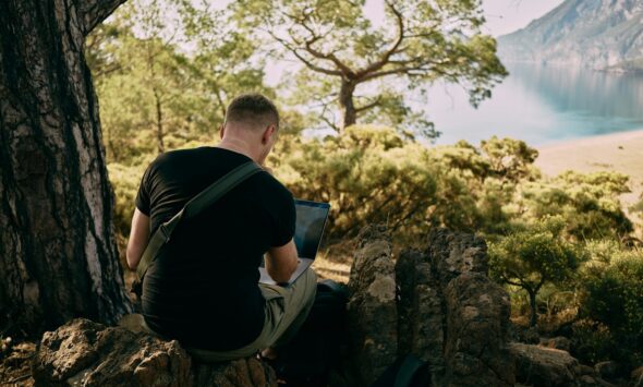 EU Digital Nomad Visas 2026 African remote worker with laptop in European cafe