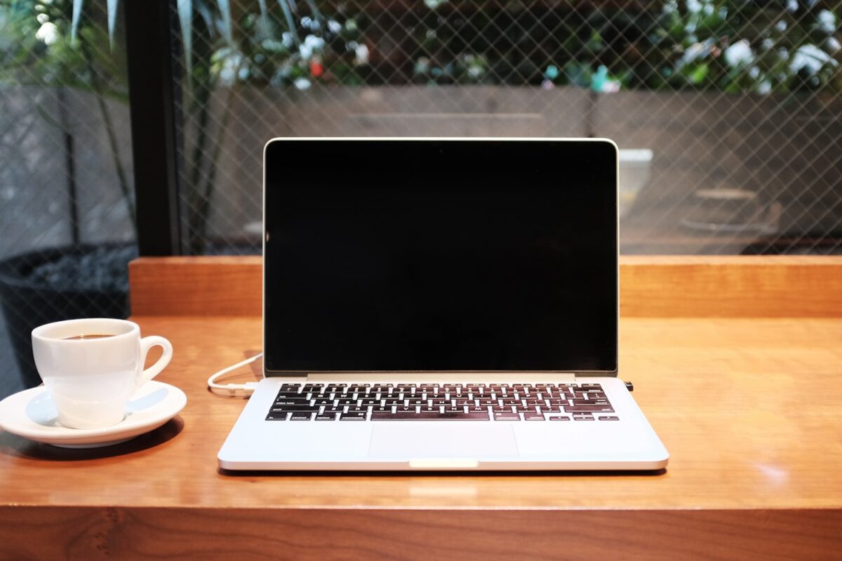 Remote worker laptop in a European cafe &mdash; EU Digital Nomad Visas 2026 comparison for Africans