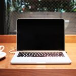 Remote worker laptop in a European cafe &mdash; EU Digital Nomad Visas 2026 comparison for Africans