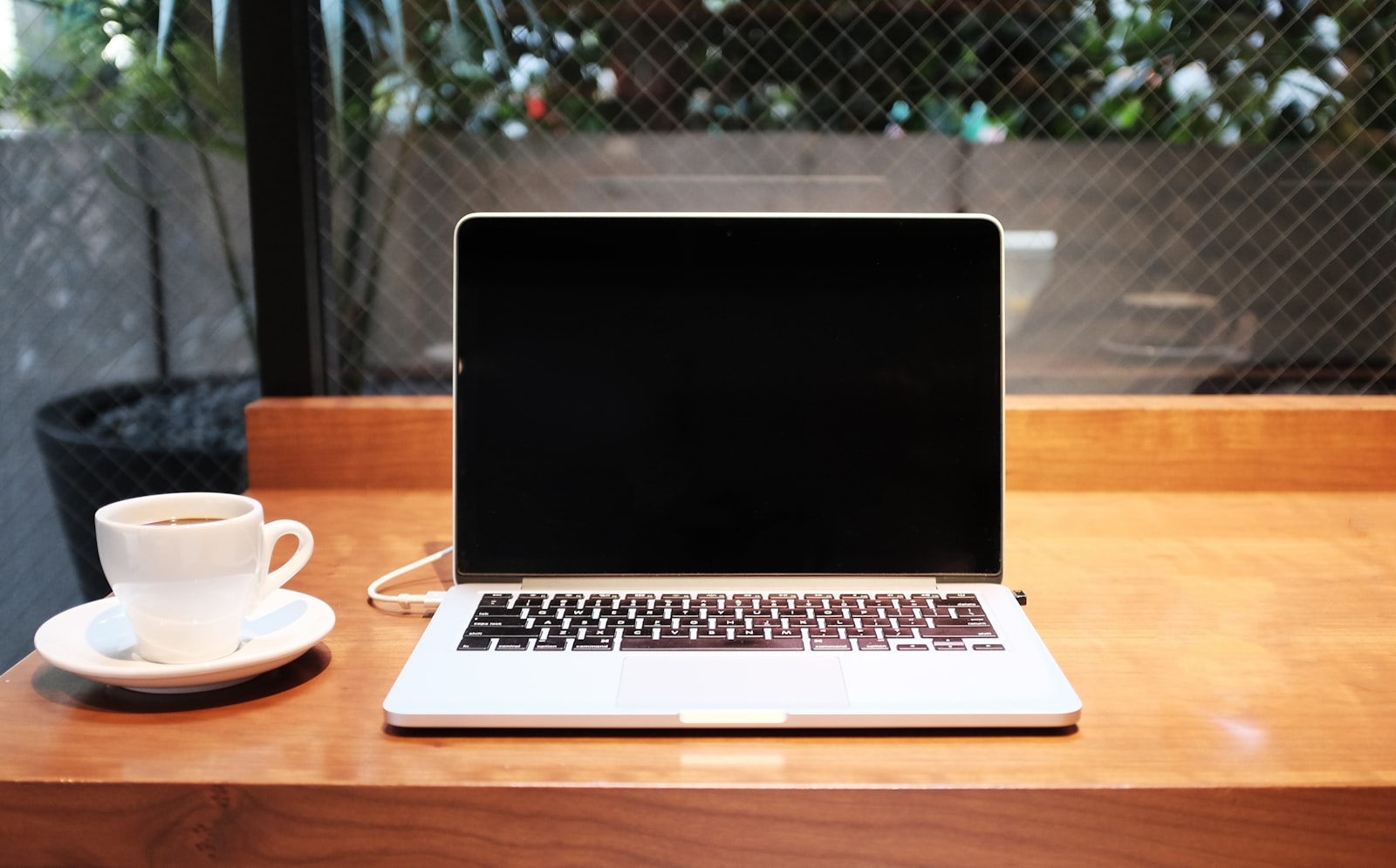 Remote worker laptop in a European cafe &mdash; EU Digital Nomad Visas 2026 comparison for Africans