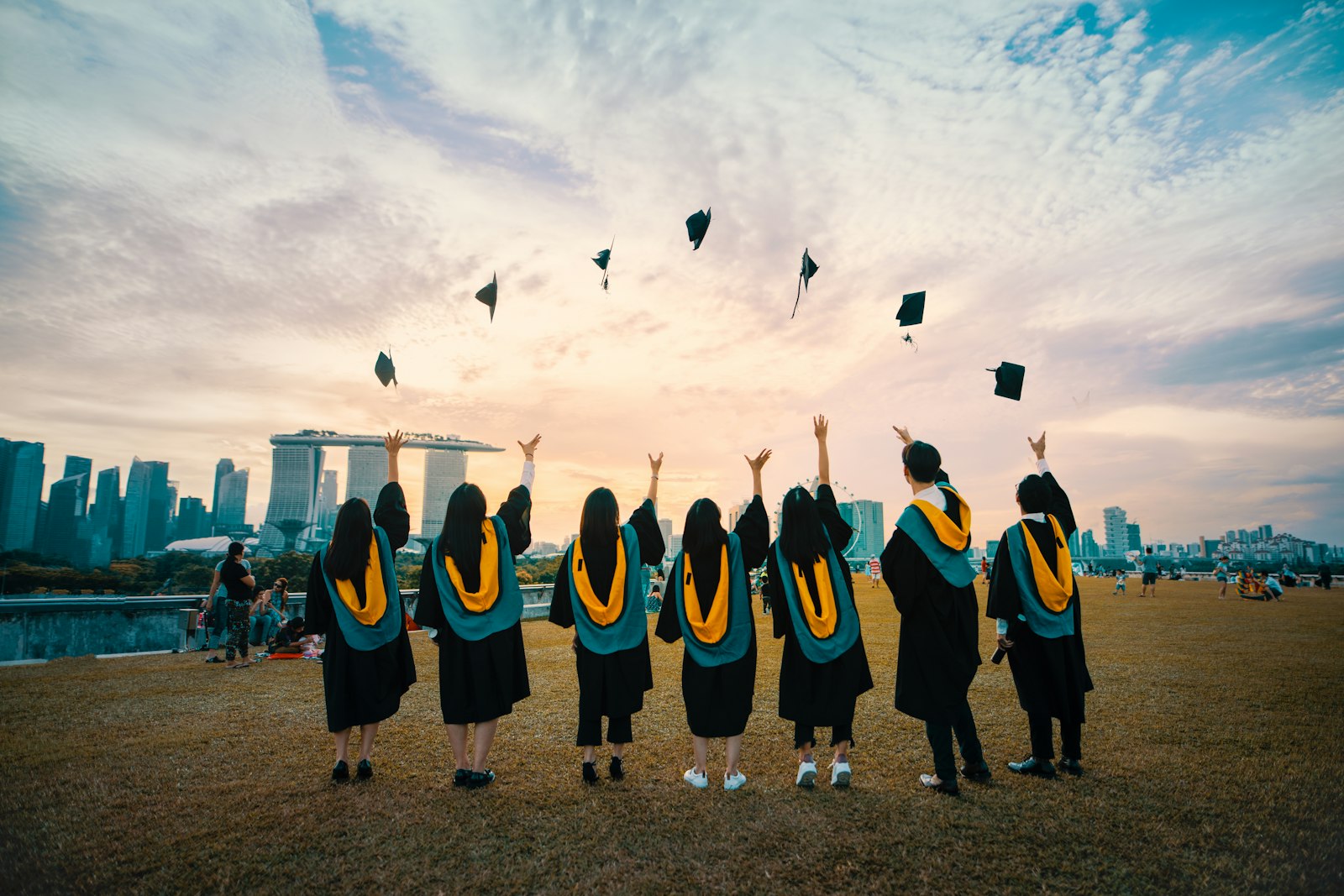 F-1 OPT STEM extension 2026 — African graduate at a US university ceremony