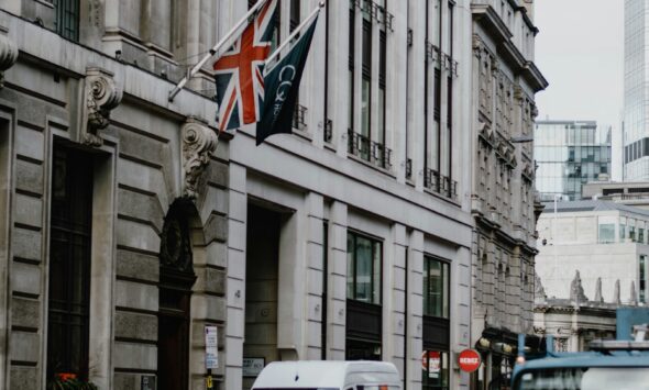 Healthcare workers in scrubs &mdash; UK Health and Care Worker Visa 2026 guide for African applicants