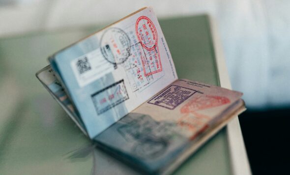 skilled worker visa refusal reasons, application documents on a desk