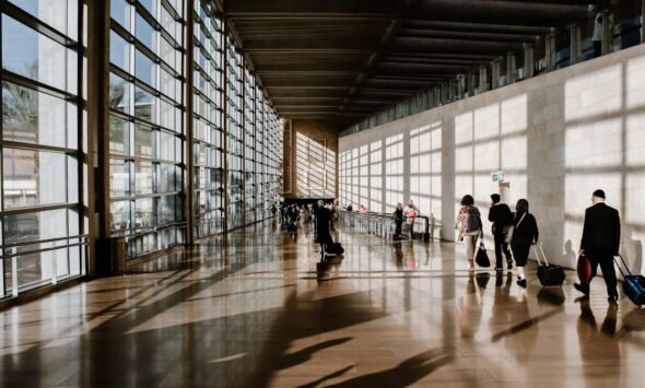 A family at the airport illustrating family and partner visa routes