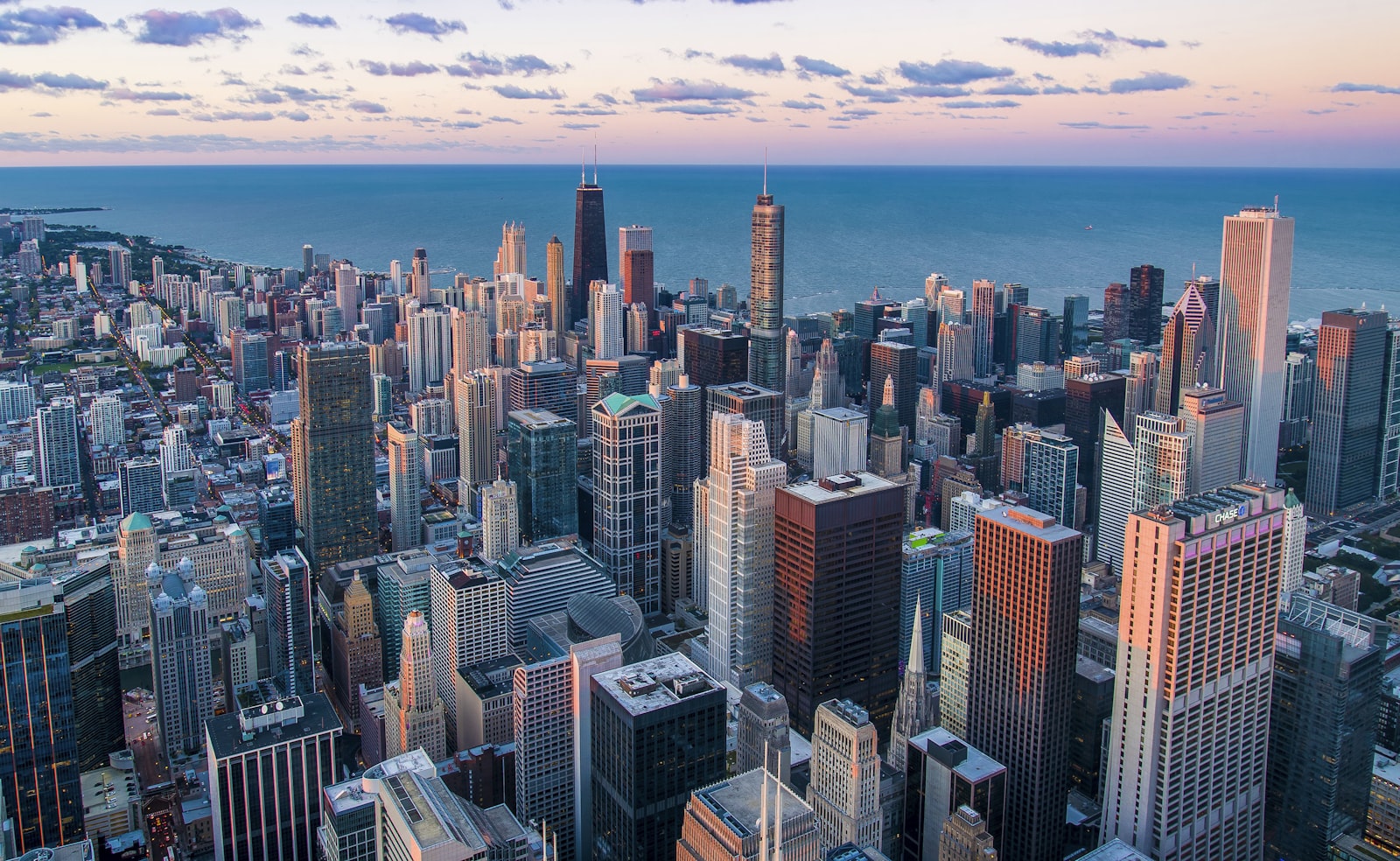 US adjustment of status interviews in 2026, Chicago skyline at dusk